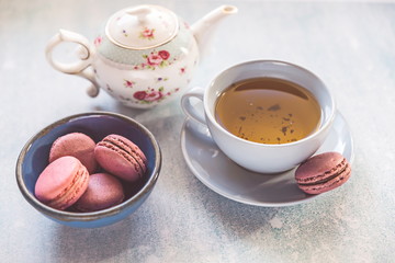 pink macaroons with teapot and Cup
