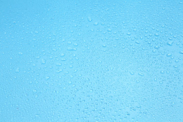 Close up water drops on blue background, Water drop in macro photography