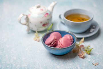 pink macaroons with teapot and Cup