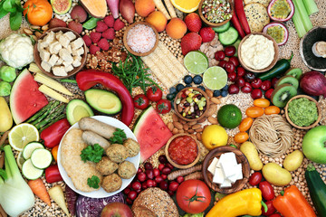 Natural healthy vegan food with foods high in protein, vitamins, minerals, antioxidants, anthocyanins, fibre, omega 3 and smart carbs. Ethical eating concept. Flat lay.