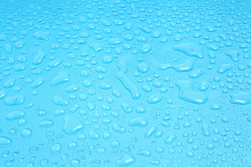 Close up water drops on blue background, Water drop in macro photography