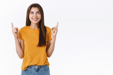 Curious, excited pretty caucasian woman checking out awesome promo, want participate cool event,...