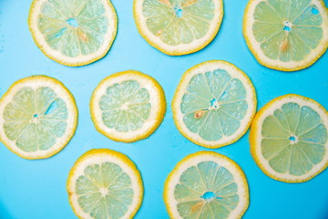 slices of lemons on a blue background