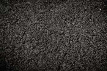Tuinposter Texture of volcanic dark stone with rough surface © Andrey