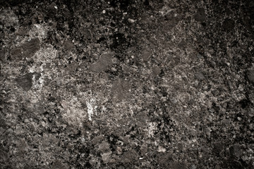 Texture of old dark stone with dirty worn surface. Abstract background