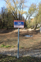 Prohibition sign Swimming is prohibited on a pole in the Park