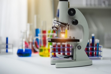 Equipment and science experiments oil pouring scientist with test tube yellow making research in laboratory.