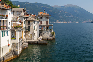 Fototapeta na wymiar Old houses on the bank of Como lake, Brienno comune, Italy