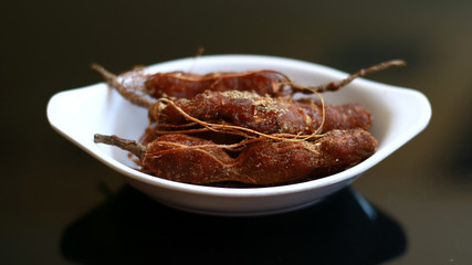 Tamarind or Tamarindus indica on black background.  
