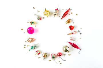 Christmas / New Year holiday composition. Mock up frame with blank copy space made of Christmas bauble decorations on white background. Flat lay, top view festive concept.