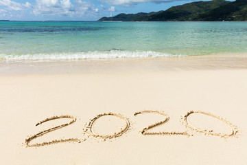 2020 Year Written On Sand Near The Sea At Beach