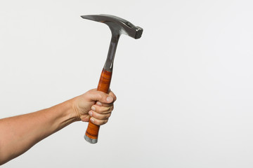 hand holding a carpenter's hammer