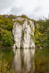 Danube river at Danube breakthrough near Kelheim, Bavaria, Germany in autumn with limestone rock...