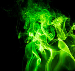 Green smoke on black background