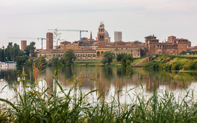 Mantua skyline reflected in lake. Lombardy, Italy