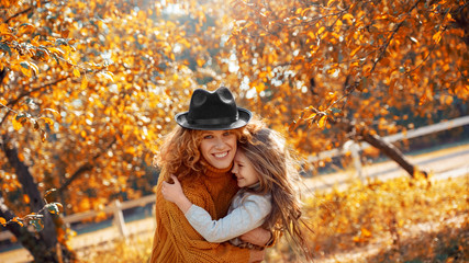 Happy woman cuddle to her cheerful child