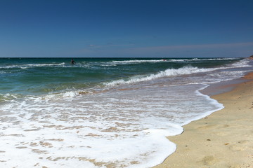 Sunny beautiful deserted sandy beach of the sea