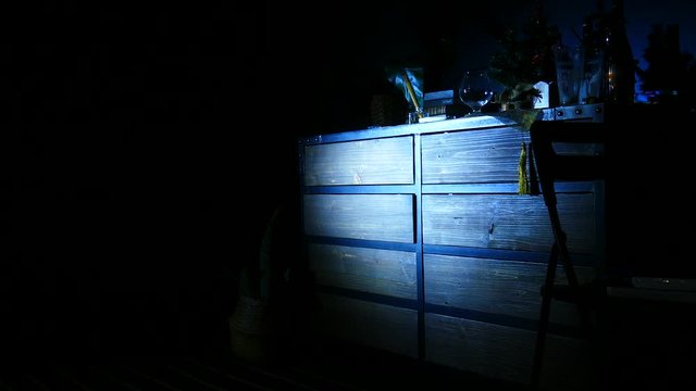 Lantern light on an old chest of drawers