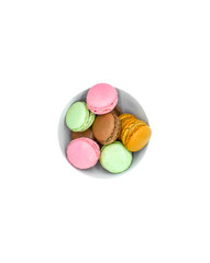 macarons in bowl, sweet colorful macarons on white background