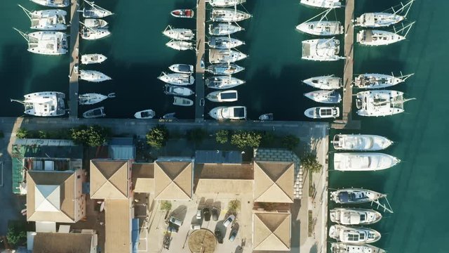 Aerial top down view of a Greek marina and sailboats