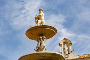 Obraz premium top figures of Praetorian fountain, figure of Saint Rosalia on Palazzo Pretoria