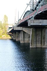 Old steel bridge to transportation on a sunny day.