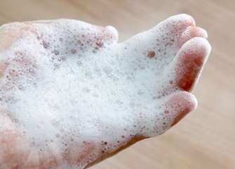 Close Up Woman Hand with Bubble Foam