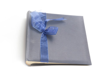 Gift album for photo with bow on isolate white background.