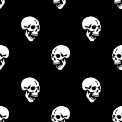 Skull skeleton seamless pattern on black background 