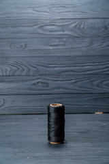 spool of red thread dark key