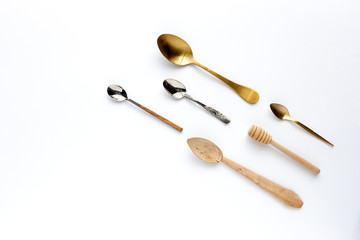 Spoons and forks on white background