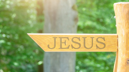 Jesus - wooden signpost with an arrow