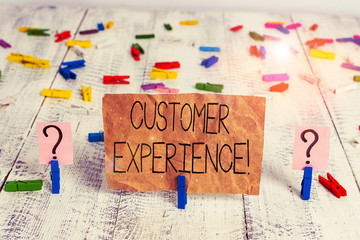 Text sign showing Customer Experience. Business photo text product of interaction between organization and buyer Scribbled and crumbling sheet with paper clips placed on the wooden table