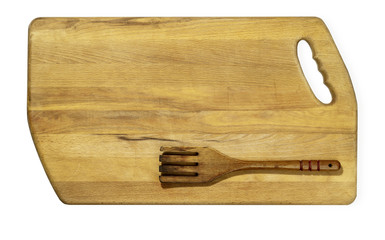wooden fork on wooden kitchen board against white background