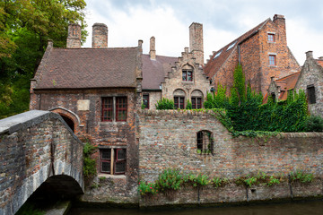 Cottages along riverbank, Brugge, Bruges, Belgium