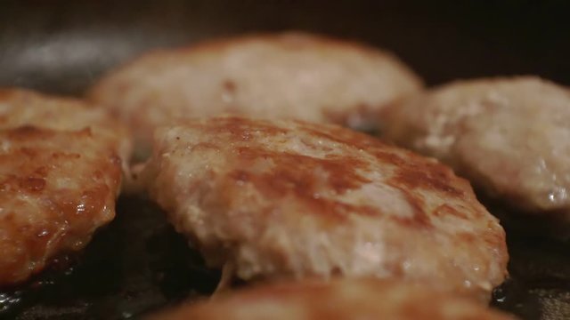 juicy cutlets fried in a metal pan.close-up.shallow depth of field.