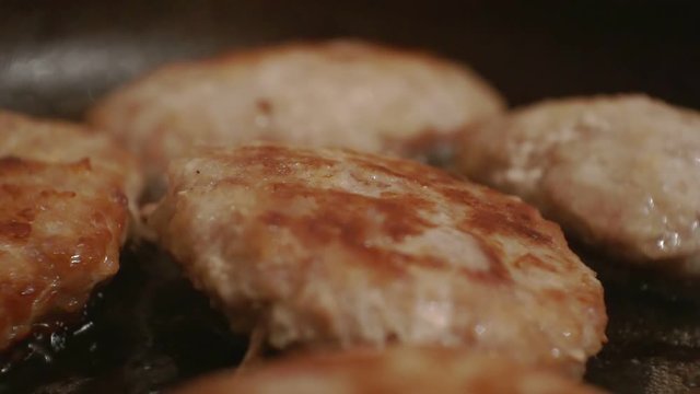 juicy cutlets fried in a metal pan.close-up.shallow depth of field.