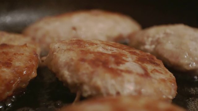juicy cutlets fried in a metal pan.close-up.shallow depth of field.