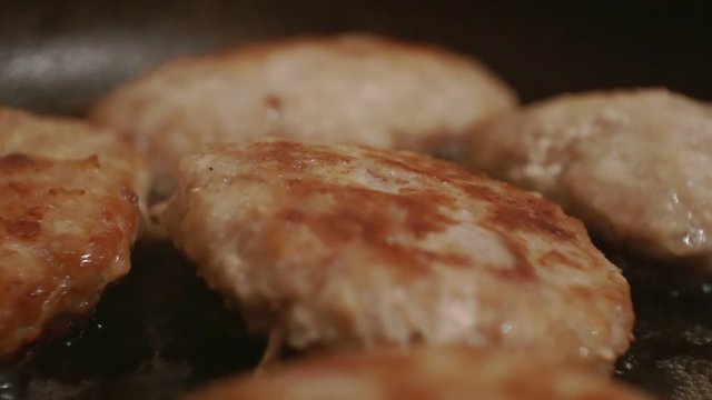 juicy meatballs made from minced meat fried in a metal pan.close-up.shallow depth of field.