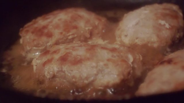 juicy meatballs made from minced meat fried in a metal pan.close-up.shallow depth of field.