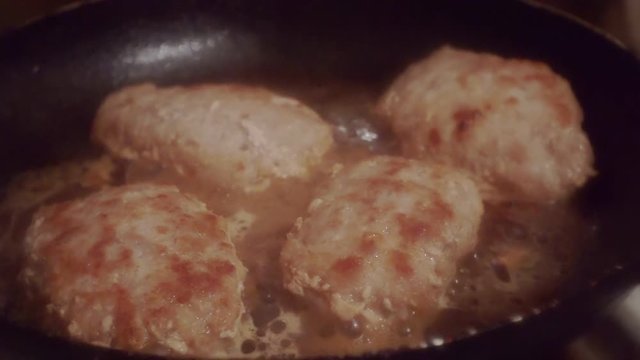juicy cutlets made from minced meat fried in a metal pan.close-up.shallow depth of field.