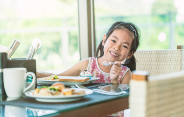 little girl having breakfast