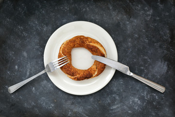 Simit turkish bagel isolated on black background.