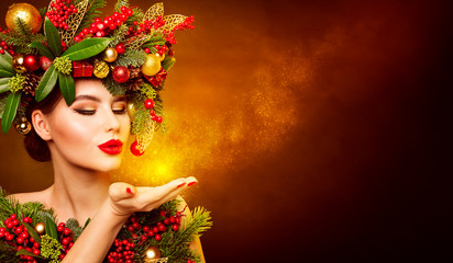Christmas Fashion Model Beauty Makeup, Wreath Hairstyle. Xmas Woman Blowing to Hand, Beautiful Artistic Face Portrait