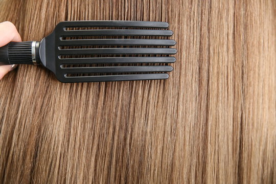 comb the hair. comb on the background of the hair with copy space.