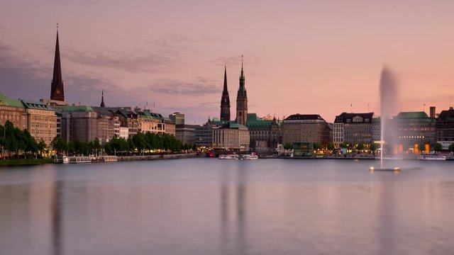 hamburg city waterfront timelapse day to night seen from alster lake zoom out