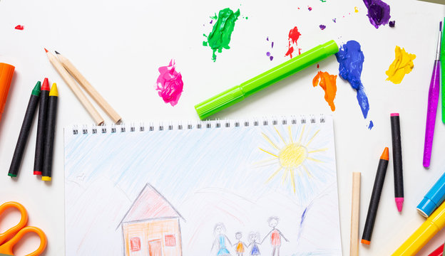 Colorful paints and family home drawing on white color background, top view