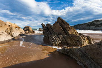 Fototapeta premium Flysch rock formation at a north atlantic ocean beach in spain near bilbao and santander during winter time.