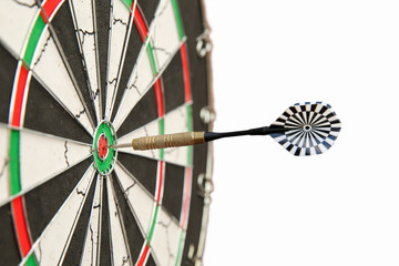 dart sticking out of a darts board on a white background close up with copy space