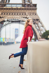 Young woman with long blond curly hair in Paris, France